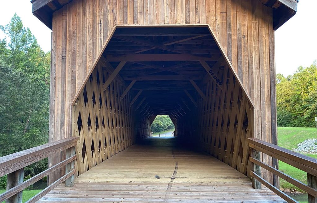 An inside view of the covered bridge and its unique lattice design.